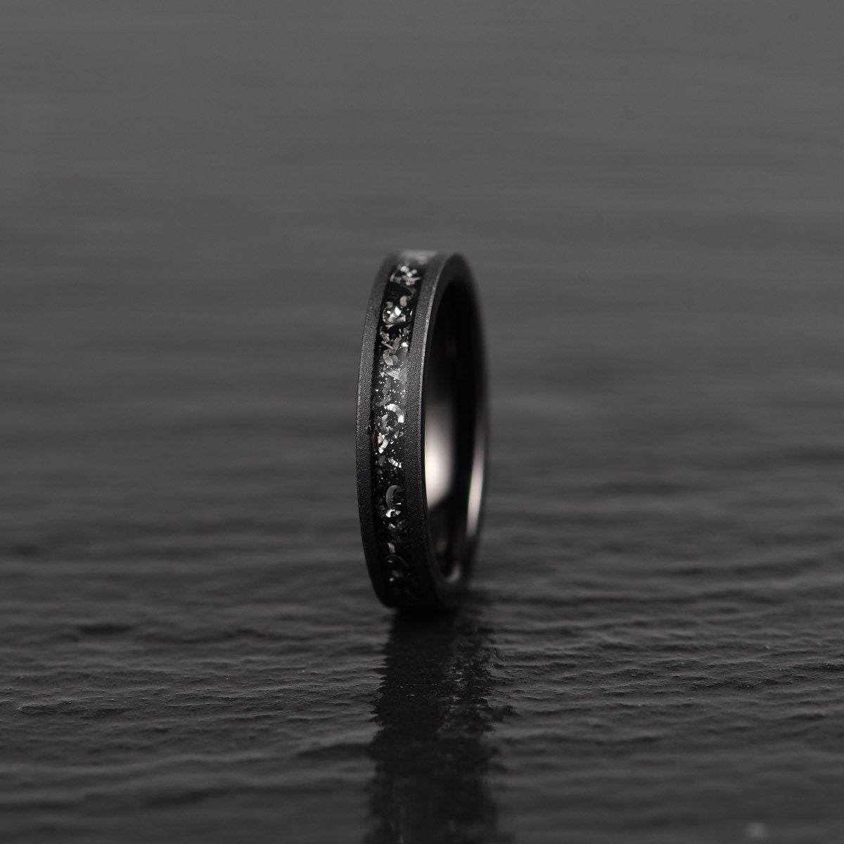 Crushed meteorite inlay sandblasted black tungsten men's wedding band 4mm facing front